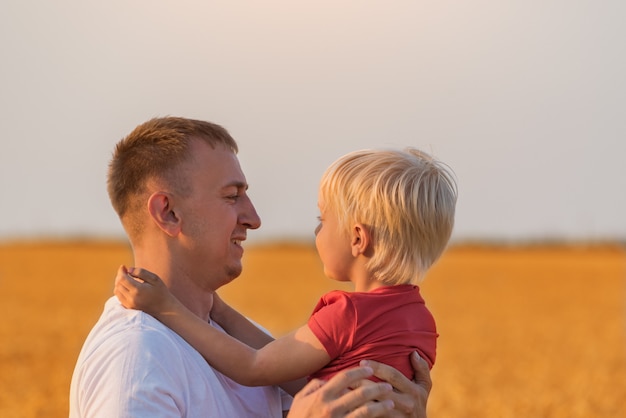 Father holding his son in arms