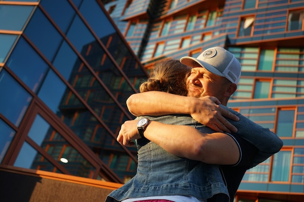 The father hugs her daughter with love