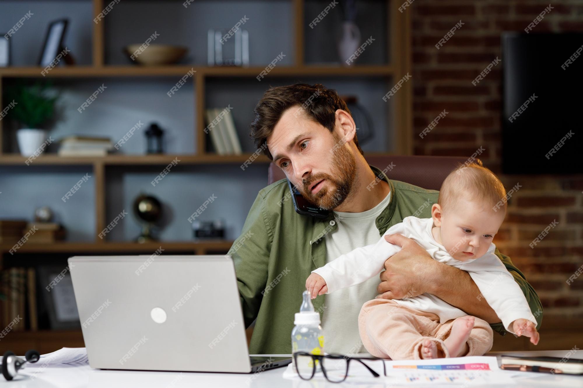 Premium Photo | Father is on maternity leave working in a home office at a  laptop with a small child in his arms freelance businessman combines child  care and work paternity leave