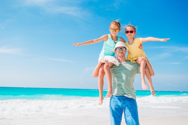 Father and kids enjoying beach summer vacation