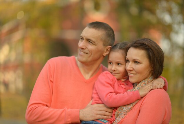 Father and mother with daughter in park