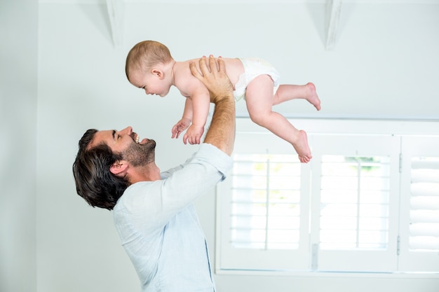 Father playing with baby boy