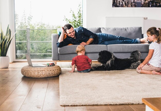 Father playing with his kids at home