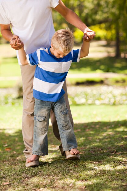 Father playing with his son  in the park