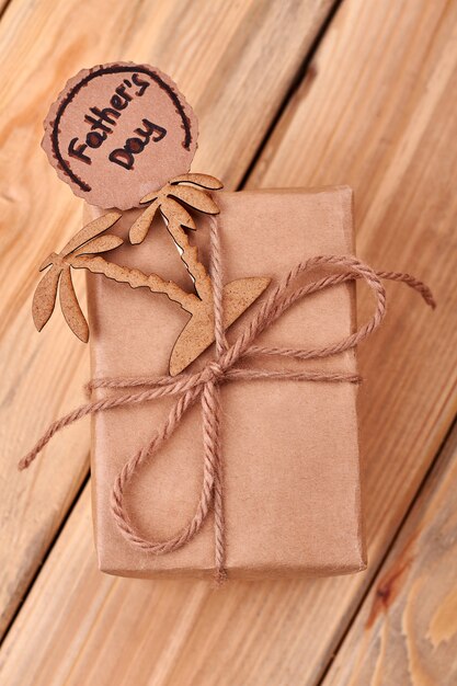 Father's Day card and palms. Rope bow on present box. Trip to exotic countries.