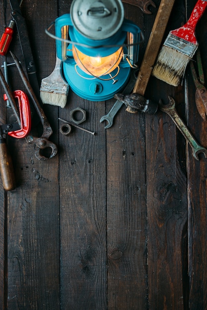 Father's day concept with vintage tools set on dark brown wooden background with empty space