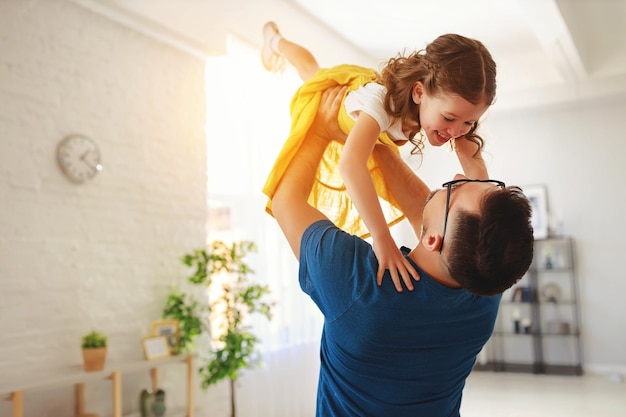 Father's day Happy family daughter hugs his dad