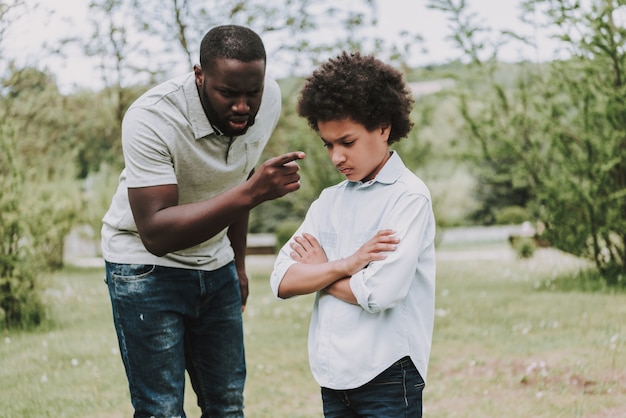 Father Scolds Son and Boy Turned Away from him