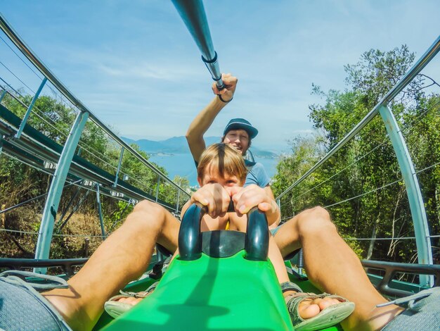 Father and son on the alpine coaster