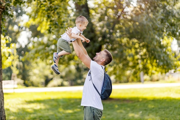 Father and son are playing in the park