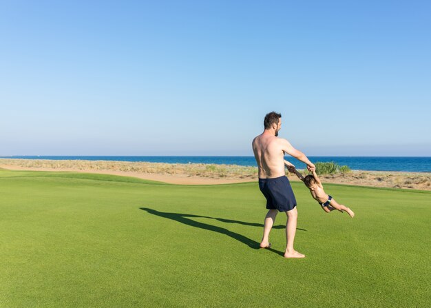 Father and son on beach