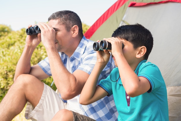 Father and son beside their tent