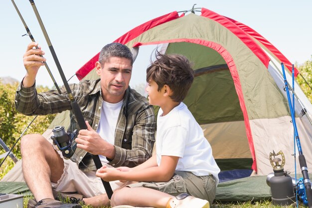 Father and son by their tent