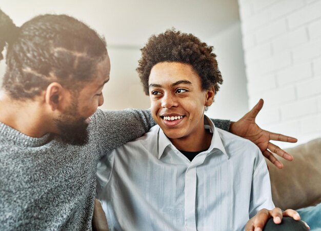 Photo father son family man child conversation talking parent boy happy discussion communication together togetherness bonding care black home talk love dad fun leisure joy