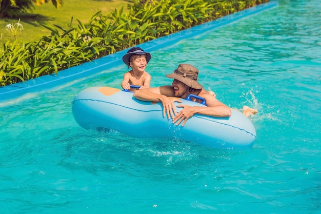 Father and son have fun at the water park.