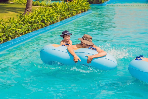 Father and son have fun at the water park.