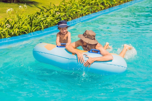 Father and son have fun at the water park.