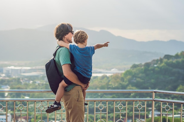 Father and son on High view from Phuket View Point Rang Hill in Phuket Thailand