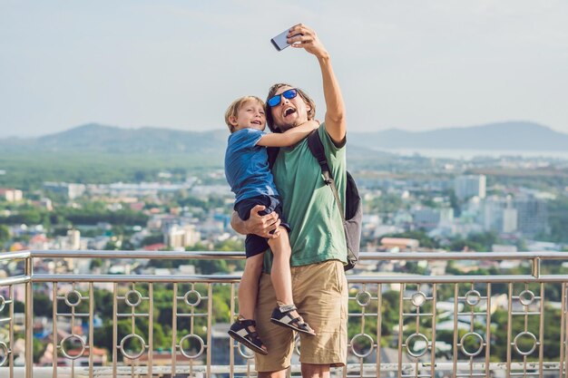 Father and son on High view from Phuket View Point Rang Hill in Phuket Thailand.