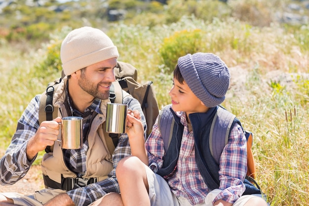 Father and son hiking in the mountains