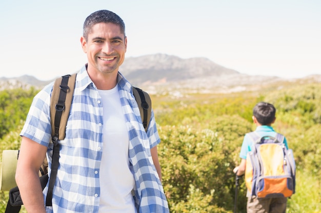 Father and son hiking in the mountains