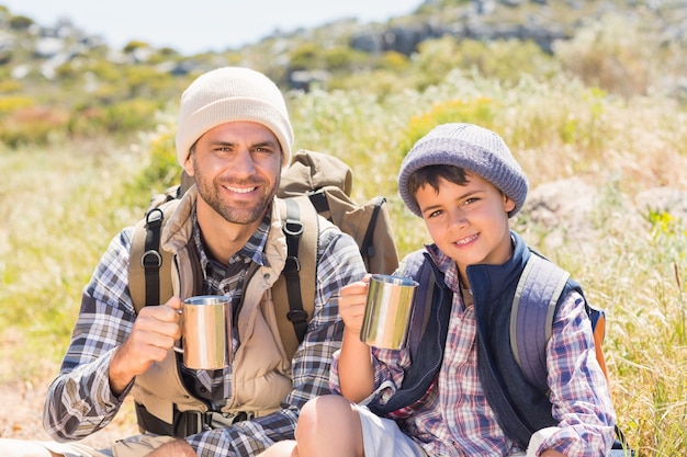 Father and son hiking in the mountains