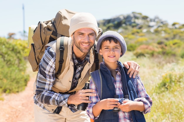 Father and son hiking in the mountains