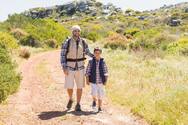 Father and son hiking in the mountains