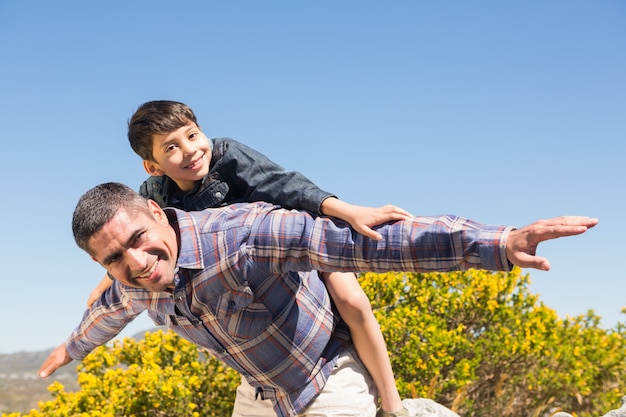 Father and son hiking through mountains 