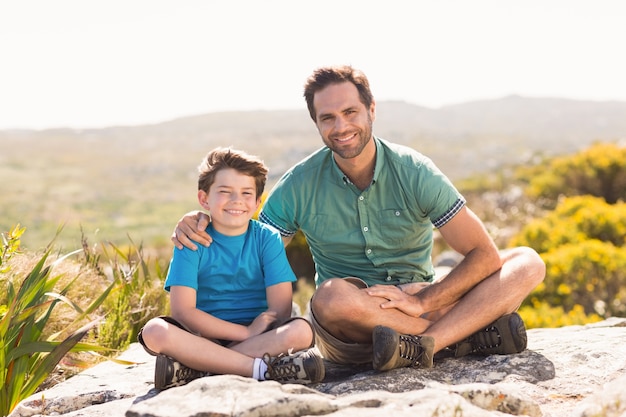 Father and son hiking through mountains