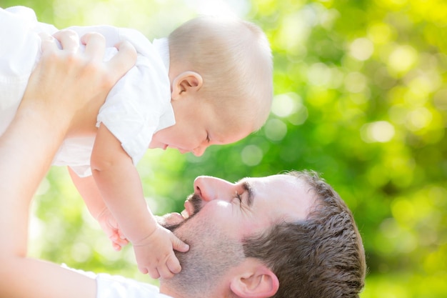 Father and son outdoors Baby boy having fun with dad