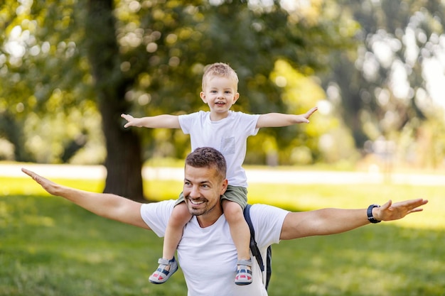 Father and son play in nature