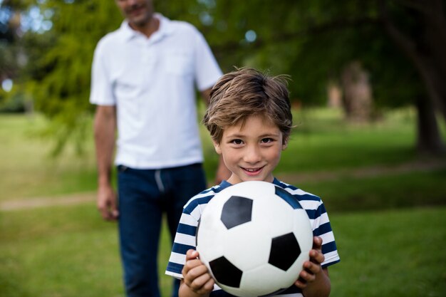 Father and son playing football