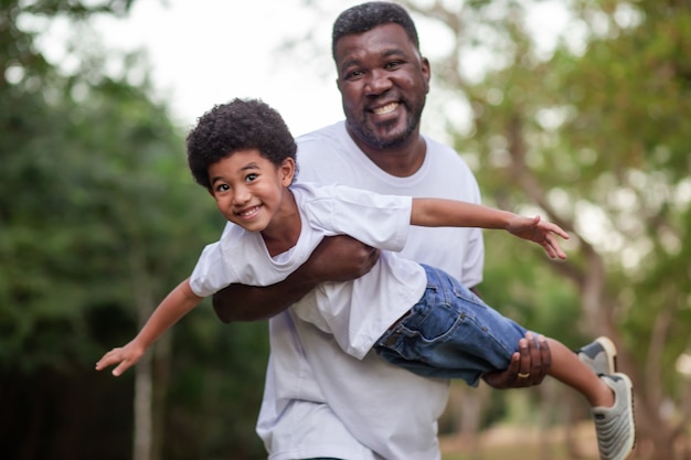 Father and son playing outdoors in the park