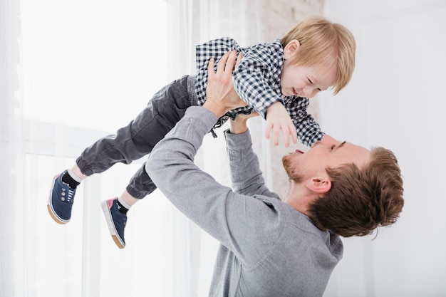 Father and son playing together on fathers day