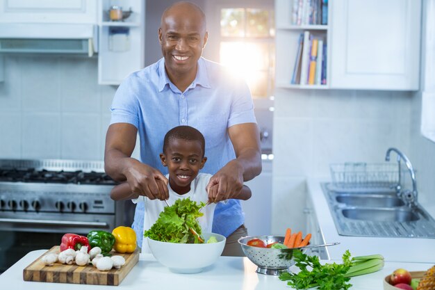 Father and son preparing food