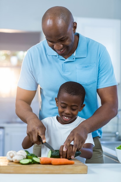 Father and son preparing food