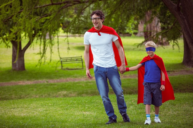 Father and son pretending to be superhero