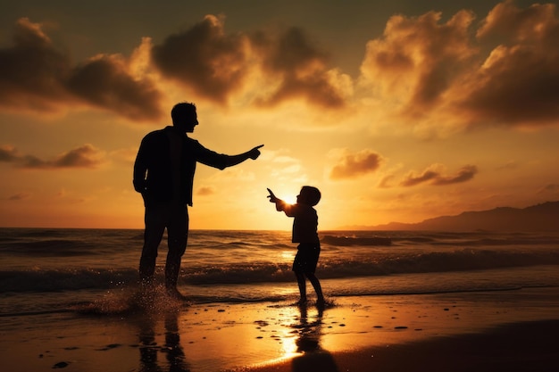 Силуэты отца и сына, гуляющие вместе на пляже при закате. Счастливые отношения в семье.