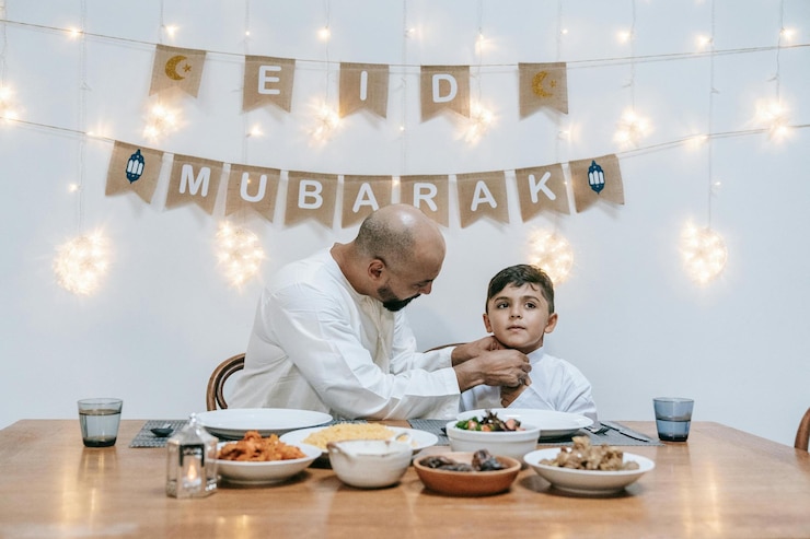 Photo father and son sitting at the table stock photo