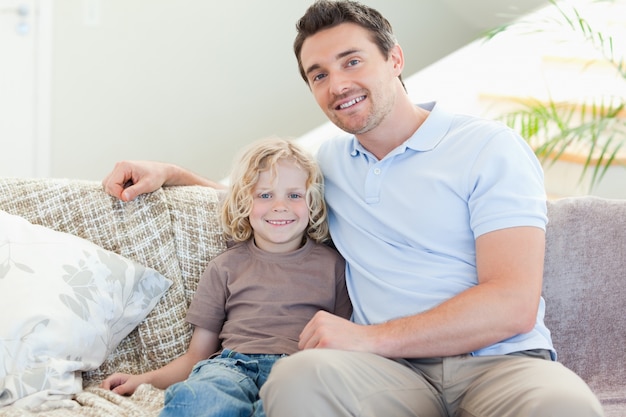 Father and son on sofa