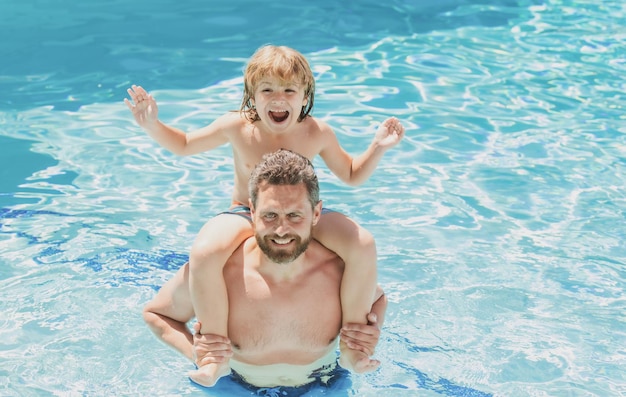 Father and son swimming in pool summer family weekend dad and son relax in pool swimming lessons sum