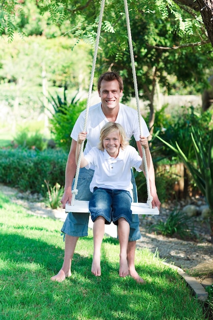 Father and son on a swing