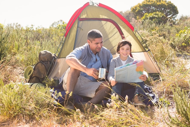 Father and son in their tent 