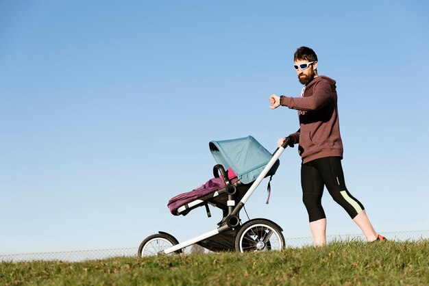 Father and son walking in the park. Family and sport concept.