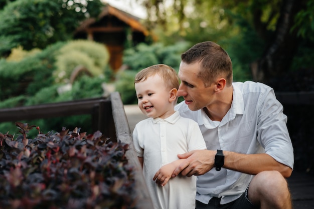 Father and son walking in the Park at sunset. Happiness. Love