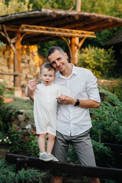 Father and son walking in the Park at sunset. Happiness. Love