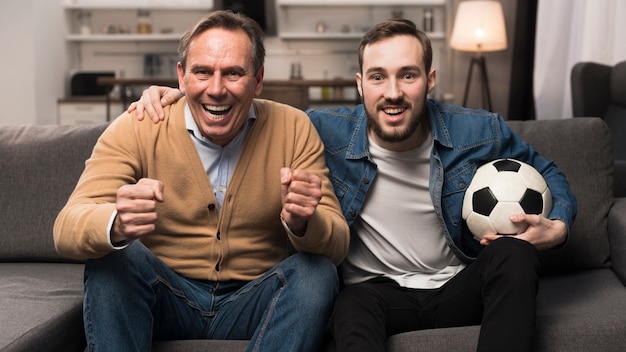 Father and son watching sports