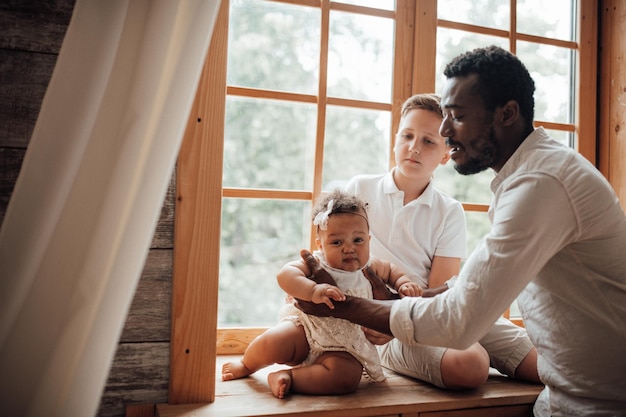 Photo father and son on window