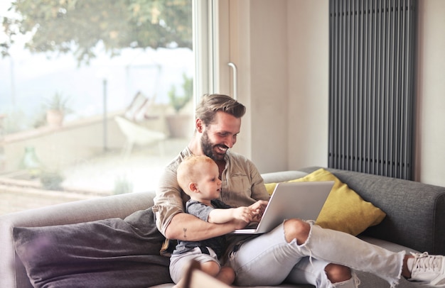 father and son with laptop